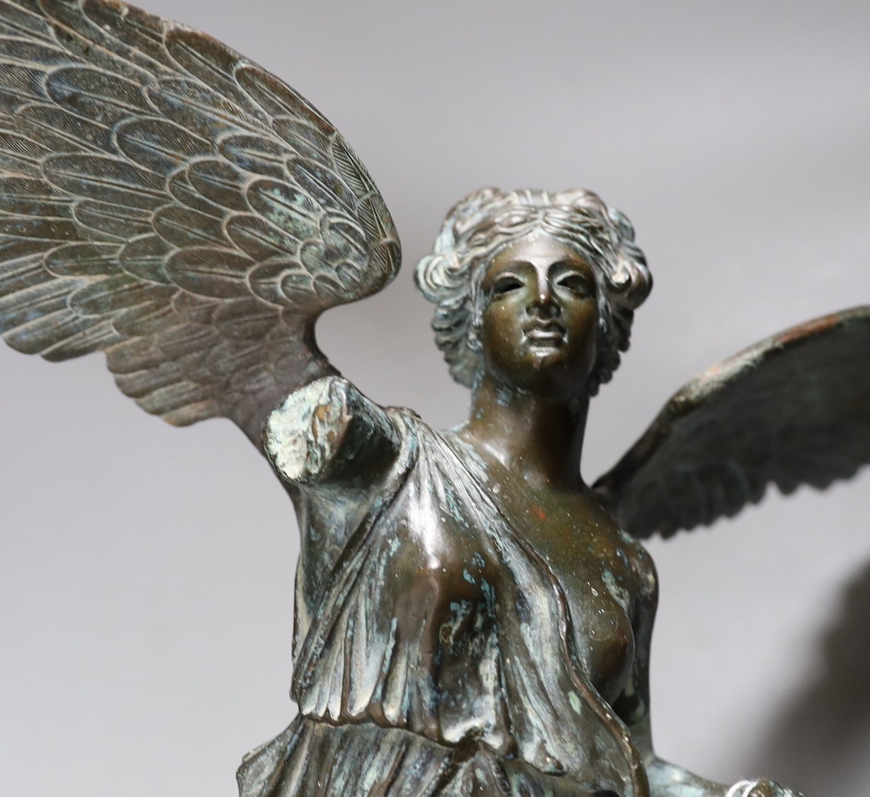 Weathered bronze, winged garden figure, 52 cms high